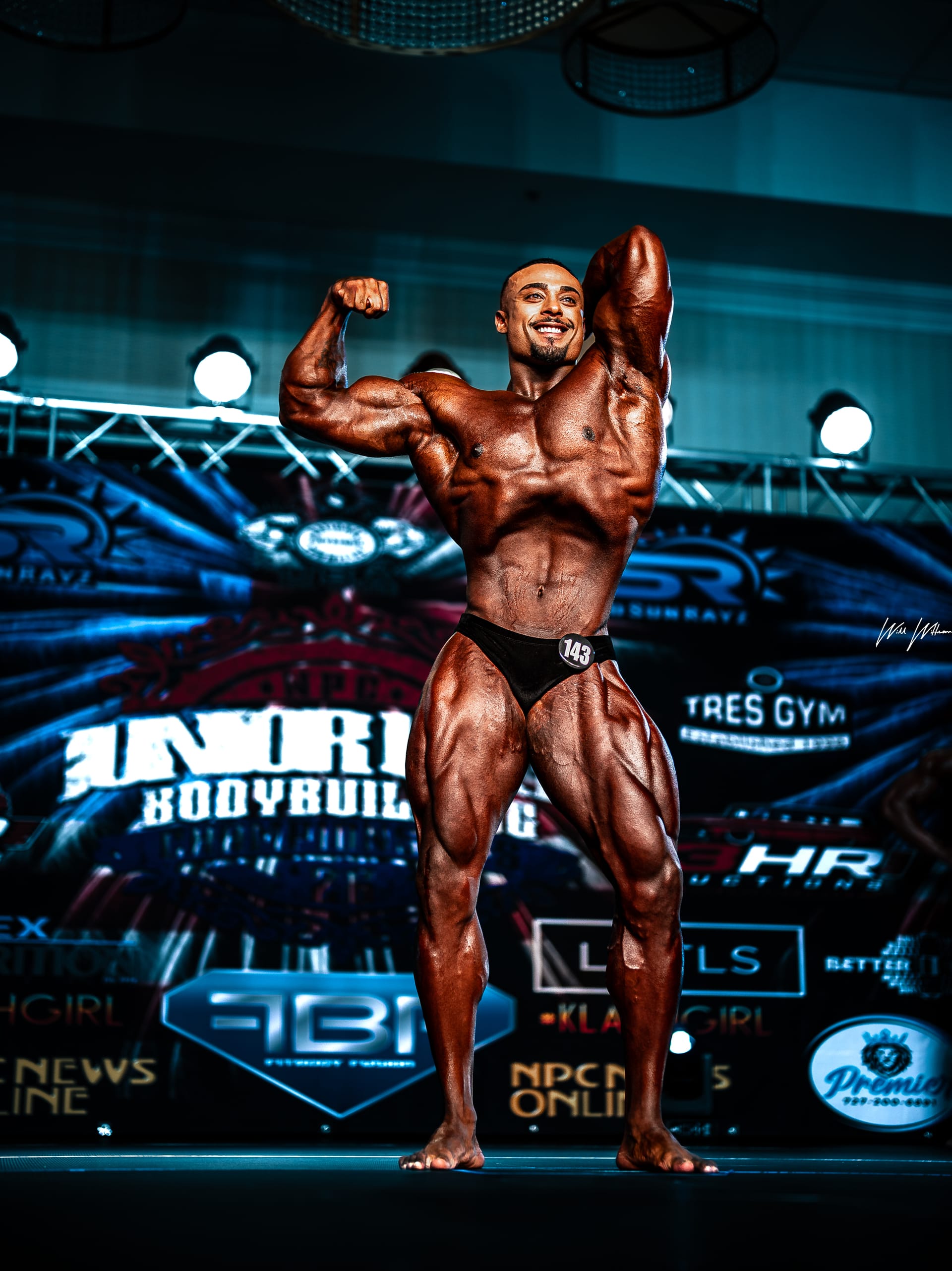 Bodybuilder posing on competition stage